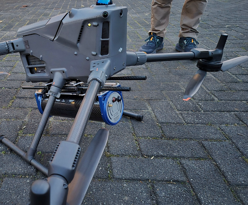 Medusa MSB-303 universal mounting plate installed on a drone, with detector attached